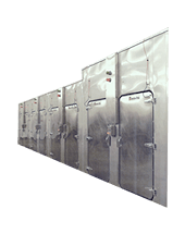 A row of stainless steel refrigerators lined up against each other.