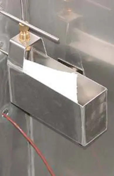 A stainless steel sink with a faucet and a metal box.